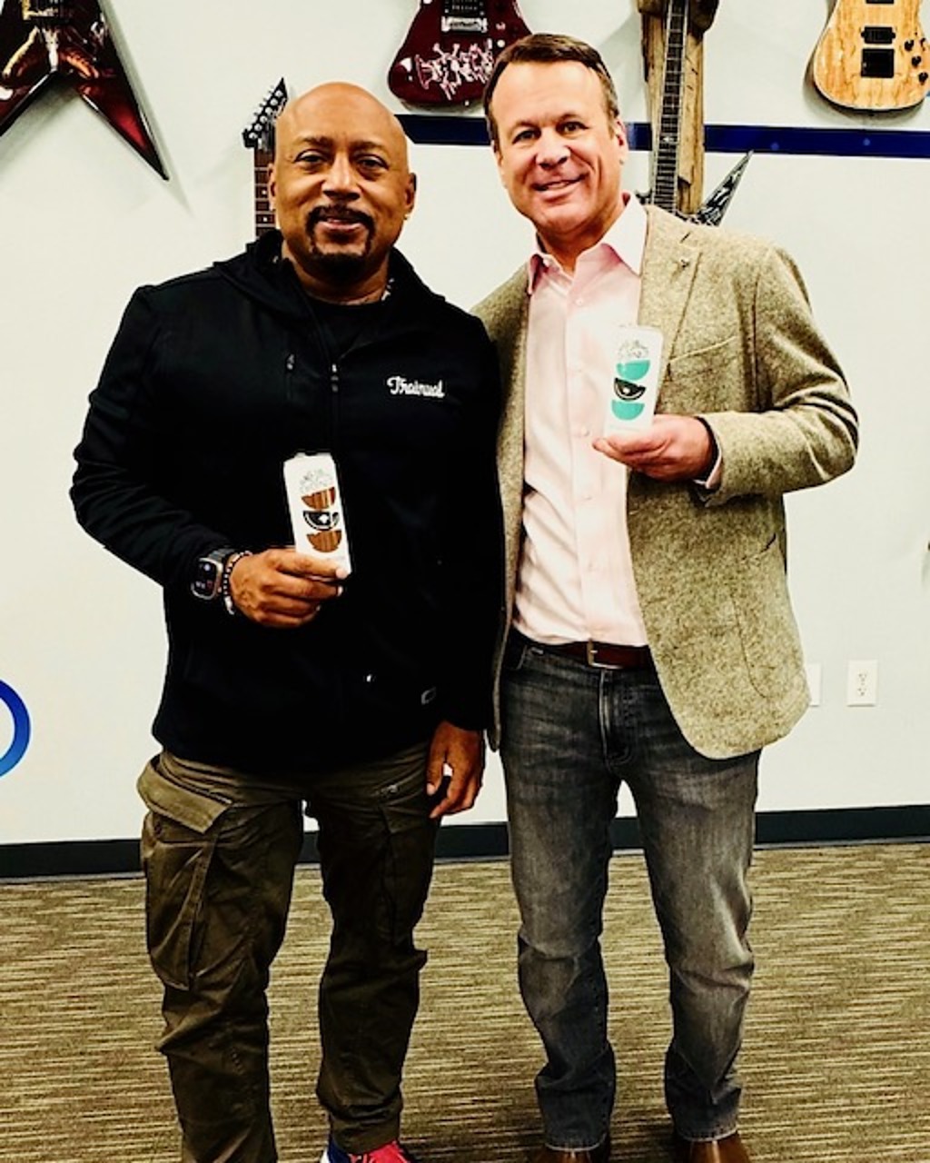 Mark Ellis with Daymond John of Shark Tank holding Once Upon A Coconut cartons