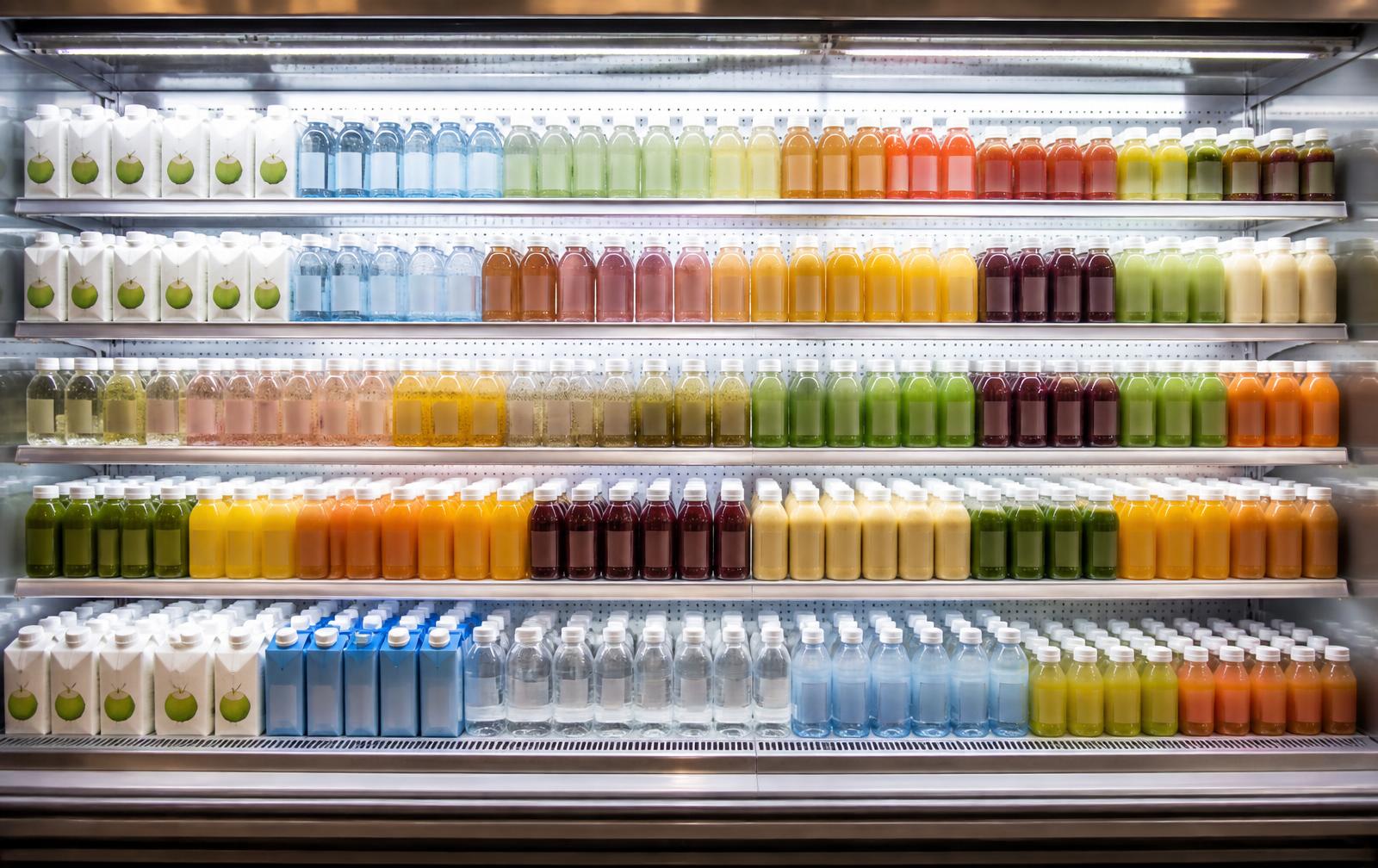 Fully stocked beverage cold case in a modern grocery store